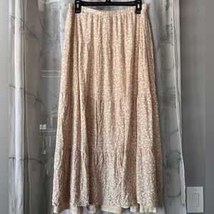 Cream and white skirt with a seam sewn under. Not see through. Size M.